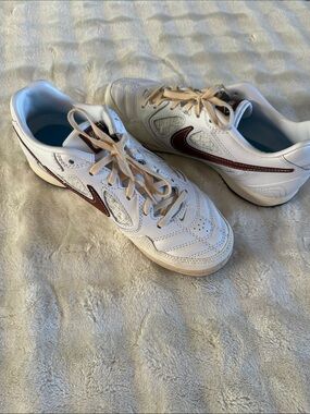Nike Women's White Sneakers with Brown Swoosh